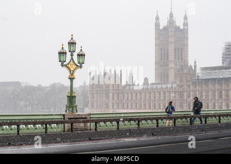 Snowstorm over the british parliament as seen from Westminster bridge on a cold spring day in march 2018 at London, England. Stock Photo