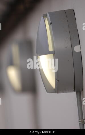 Outside lights on the walls of industrial buildings Stock Photo