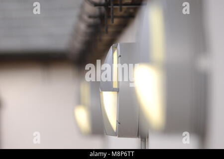 Outside lights on the walls of industrial buildings Stock Photo