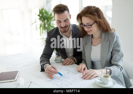Group of architects working together on project Stock Photo