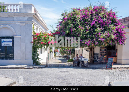A couple eating outside in Colonia, Uruguay Stock Photo