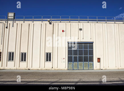 Cargo gate of Industrial warehouse. Industrial door. View on the one gates of big warehouse facade. Front view Stock Photo