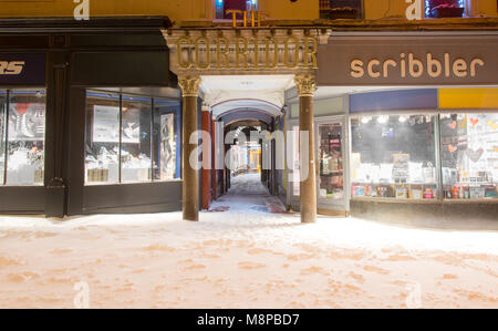 BATH, UK - MARCH 01 2018 The Corridor in Bath, in the snow at night. Shopping arcade in UNESCO World Heritage city Stock Photo