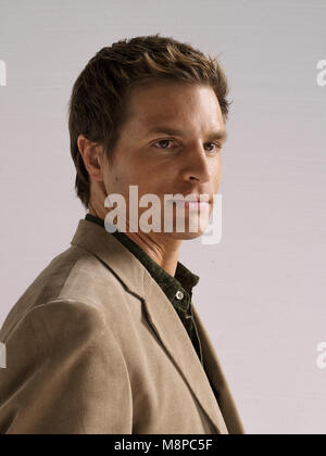 studio portrait of attractive white male headshot against neutral background Stock Photo