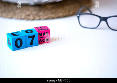 modern perpetual calendar composed of colored cubes and set at the date of May 7th Stock Photo