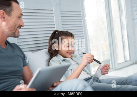 Pleasant nice girl using smart technologies Stock Photo