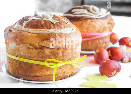Easter background. Traditional food on the holiday table - Easter Cake, cookies  and Easter painted eggs Stock Photo