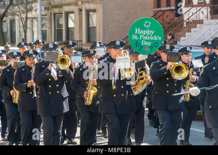 Members of the NYPD Marching Band at the 43rd Annual Irish-American Parade in the Park Slope neighborhood of Brooklyn in New York on Sunday, March 18, 2018. The family friendly event in the family friendly Park Slope neighborhood attracted hundreds of families as onlookers and marchers as it wound its way through the Brooklyn neighborhood. New York has multiple St. Patrick's Day Parades, at least one in each of the five boroughs. (Â© Richard B. Levine) Stock Photo