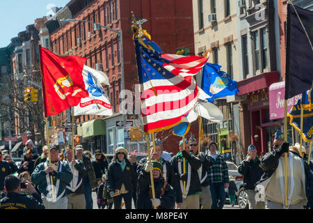 Veterans from branches of the military carry flags as they celebrate St. Patrick's Day at the 43rd Annual Irish-American Parade in the Park Slope neighborhood of Brooklyn in New York on Sunday, March 18, 2018. The family friendly event in the family friendly Park Slope neighborhood attracted hundreds of families as onlookers and marchers as it wound its way through the Brooklyn neighborhood. New York has multiple St. Patrick's Day Parades, at least one in each of the five boroughs. (© Richard B. Levine)