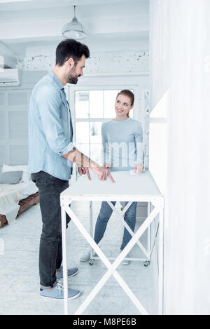 Joyful young people looking at each other Stock Photo