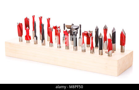 large set of drill bits for wood in wooden stand on a white background Stock Photo