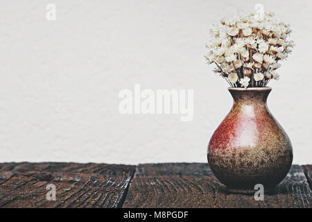 Dried flowers in the vase for decoration with empty wall in vintage minimalist style Stock Photo