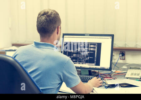 Engineering working on computer. Stock Photo