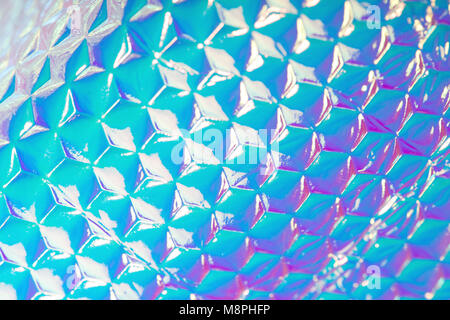 Holographic ultra violet foil creative background with geometric pattern. Stock Photo