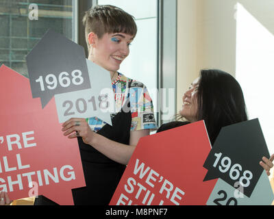 Glasgow, Scotland, UK. 19th March, 2018. Two students studying Communication Design at the Glasgow School of Art (the GSA) have won a competition to design a logo for housing and homelessness charity, Shelter Scotland's 50th anniversary. The young designers, Emily Wang (aged 21, from Hong Kong) and Sophie Rowan (aged 21, from Motherwell), submitted concepts for the contest, judged by the GSA and Shelter Scotland. Pictured are Sophie (left) and Emily (right). Iain McGuinness / Alamy Live News Stock Photo