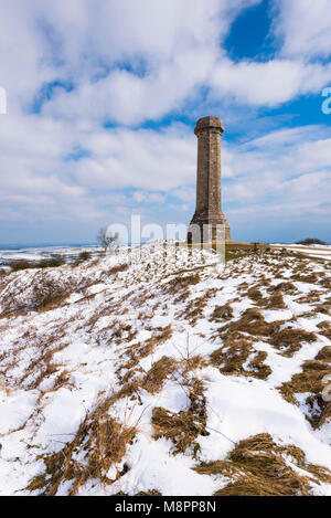Hardy's Monument, Portesham, Dorset, UK.  19th March 2018.  UK Weather.  Snow at Hardy's Monument on Black Down near Portesham in Dorset on an afternoon of sunny spell but cold winds.  The monument was built in memory of Vice Admiral Sir Thomas Masterman Hardy who was captain of HMS Victory in the Battle of Trafalgar under Admiral Nelson.  Picture Credit: Graham Hunt/Alamy Live News. Stock Photo