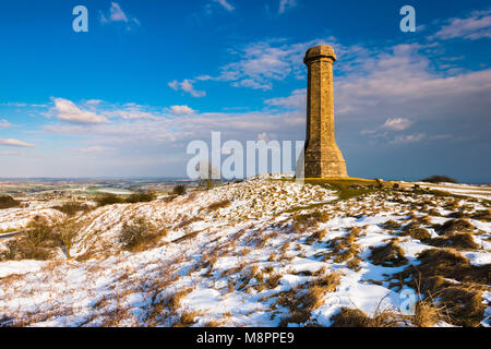 Hardy's Monument, Portesham, Dorset, UK.  19th March 2018.  UK Weather.  Snow at Hardy's Monument on Black Down near Portesham in Dorset on an afternoon of sunny spells but cold winds.  The monument was built in memory of Vice Admiral Sir Thomas Masterman Hardy who was captain of HMS Victory in the Battle of Trafalgar under Admiral Nelson.  Picture Credit: Graham Hunt/Alamy Live News. Stock Photo