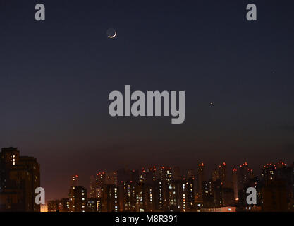 Dalian, Dalian, China. 20th Mar, 2018. Dalian, CHINA-20th March 2018: The Venus, Mercury and the waxing crescent moon can be seen in the sky in Dalian, northeast China's Liaoning Province, March 19th, 2018. Credit: SIPA Asia/ZUMA Wire/Alamy Live News Stock Photo