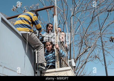Jerusalem, Israel. 20th March, 2018. Young Orthodox Jewish boys fool around during a break between lessons at school. Credit: Nir Alon/Alamy Live News Stock Photo