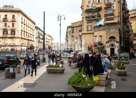 People on Piazza Capuana, in Centro Storico Napoli, opposite Porta Capuana. Naples, Italy. Stock Photo