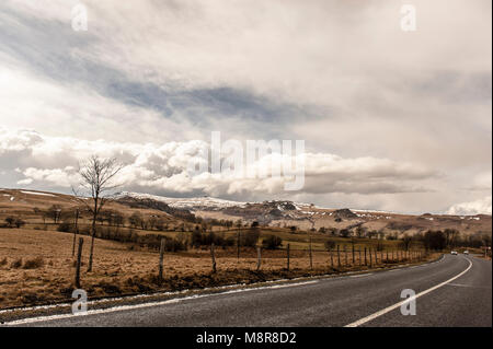 Travelling on the country road D 3 with the Cantal mountains in view, Auvergne, France Stock Photo