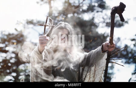 Fairy magician. A sorcerer with a glass sphere, a magical spell  Stock Photo