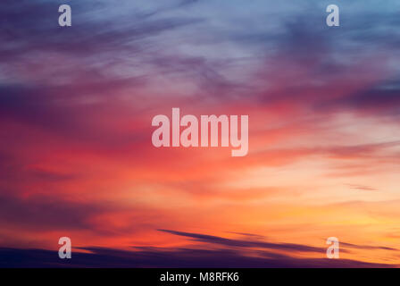 Dramatic sky at sunset, bright colored abstract clouds, Stock Photo