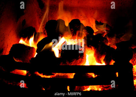 Coal Fire burning in domestic grate or fireplace or fire place at home Stock Photo