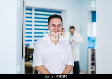Portrait of friendly male doctor smiling Stock Photo