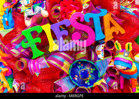 The word ‘fiesta’ written in colorful letters with glitter and