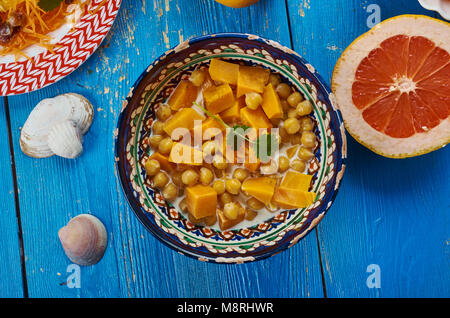 Moroccan cuisine, Chickpea Squash Tagine, Traditional assorted Moroccodishes, Top view. Stock Photo