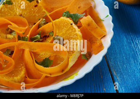 Moroccan cuisine,  Carrot Salad with Oranges and Medjool Dates, Traditional assorted Moroccodishes, Top view. Stock Photo