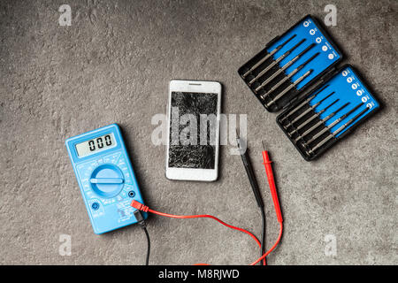 Digital multimeter on grey background Stock Photo