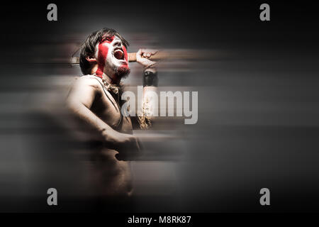 Portrait of screaming in rage ancient Spartan warrior in battle dress  against sky background Stock Photo - Alamy