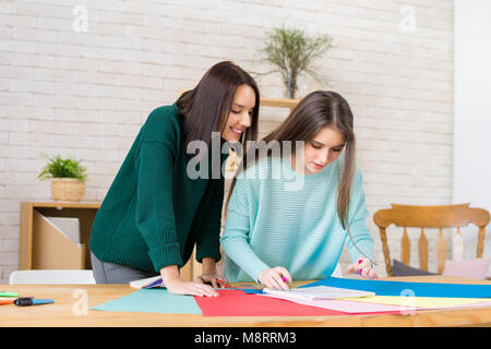 Fashion Designers Wrapped up in Work Stock Photo