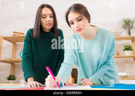 Pretty Students Working on University Project Stock Photo