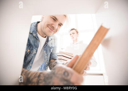 Adult student taking book Stock Photo