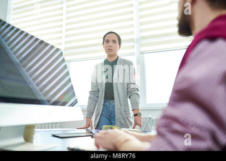 Colleagues discussing work Stock Photo