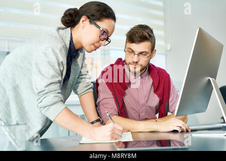 Managers cooperating in office Stock Photo