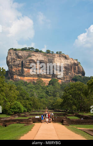 Sigiriya or Sinhagiri (Lion Rock) is an ancient rock fortress located in the northern Matale District near the town of Dambulla. The name refers to a  Stock Photo