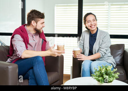 Colleagues chatting on coffee break Stock Photo