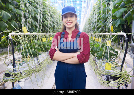 Cheerful Woman on Modern Plantation Stock Photo