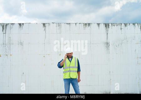 Construction Foreman Calling by Phone Stock Photo