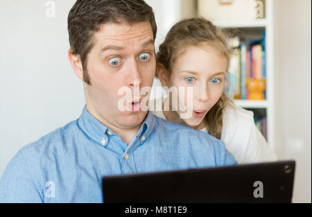 Father and his daughter using tablet pc. Stock Photo