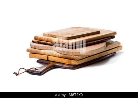 Stack  of used cutting boards isolated on white Stock Photo