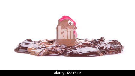 Melting chocolate easter chicken - Isolated on white background Stock Photo