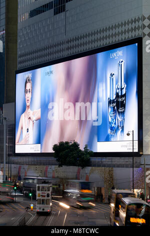 Screen displaying advert for Lancome perfume. Sogo Mall, Hong Kong, Hong Kong. Architect: Mitsubishi Electric, 2017. Stock Photo