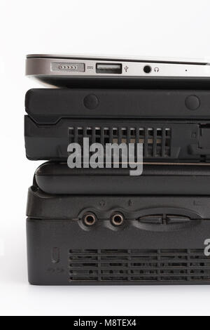 Comparing of ports of  laptops, new modern and old laptop, present and past, technology progress isolated on white background, side view. Stock Photo