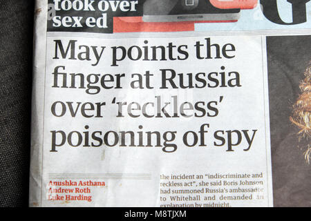 'May points the finger at Russia over 'reckless' poisoning of spy'  in Guardian front page newspaper headline 12 March 2018 London UK Stock Photo