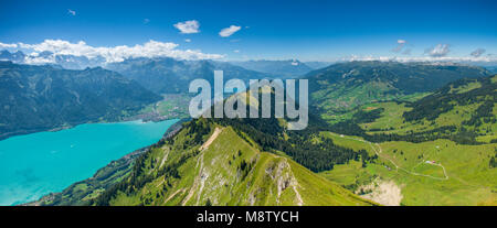 Majestic, panoramic views of the Swiss Alps, lakes and Interlaken from Hardergrat trail, ridgecrest trail, sheer drops, steep walls, forest and valley Stock Photo